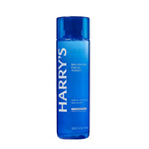 A blue translucent bottle of Harry's Balancing Facial Toner with white text, shown on a plain white background.